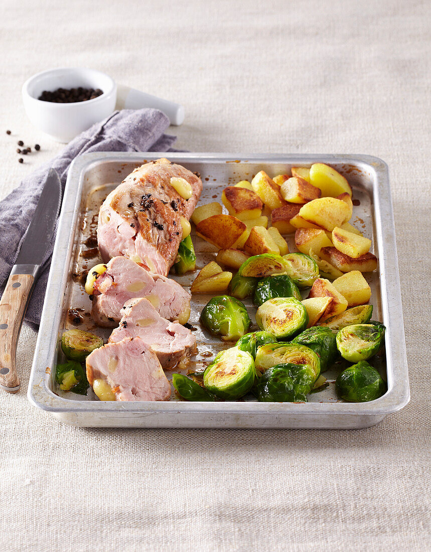 Pork Loin stuffed with wine served with carrots and Brussels sprouts