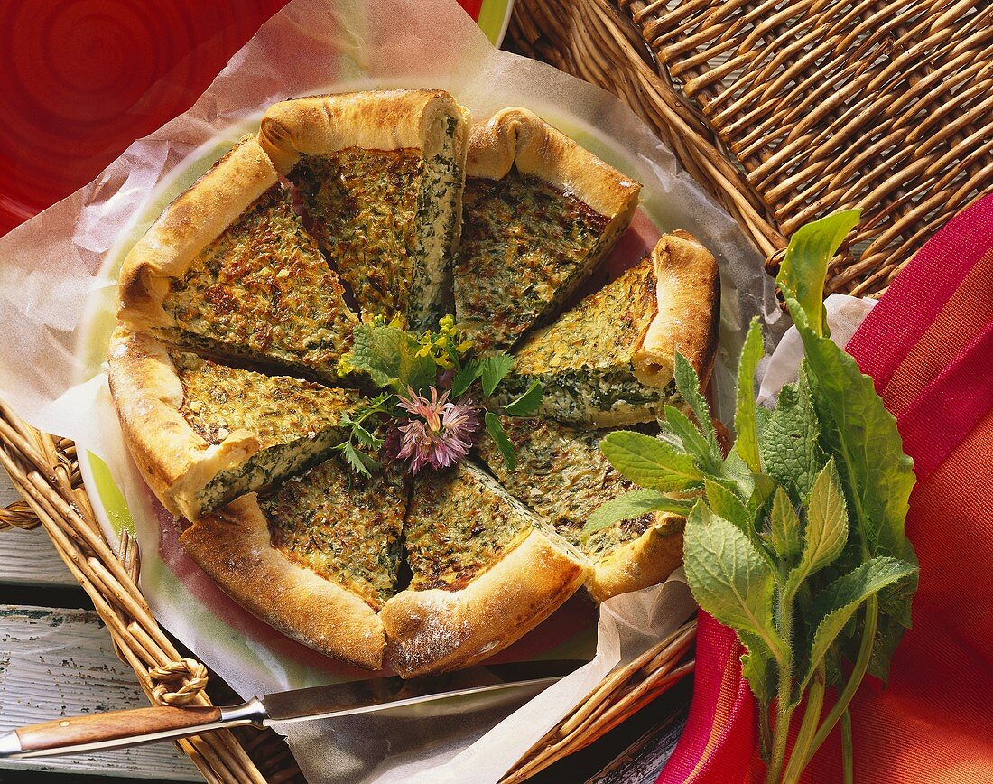 Herb soft cheese quiche with sorrel, pieces cut