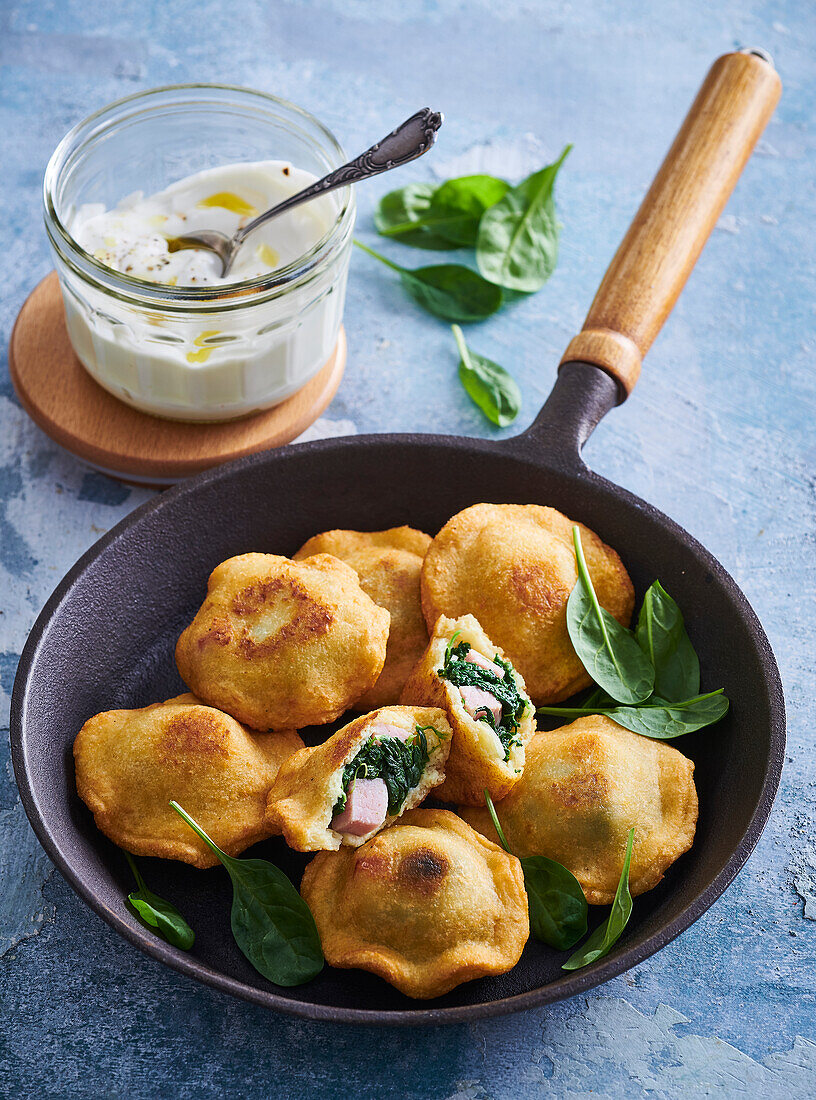 Potato pancakes filled with smoked meat and spinach