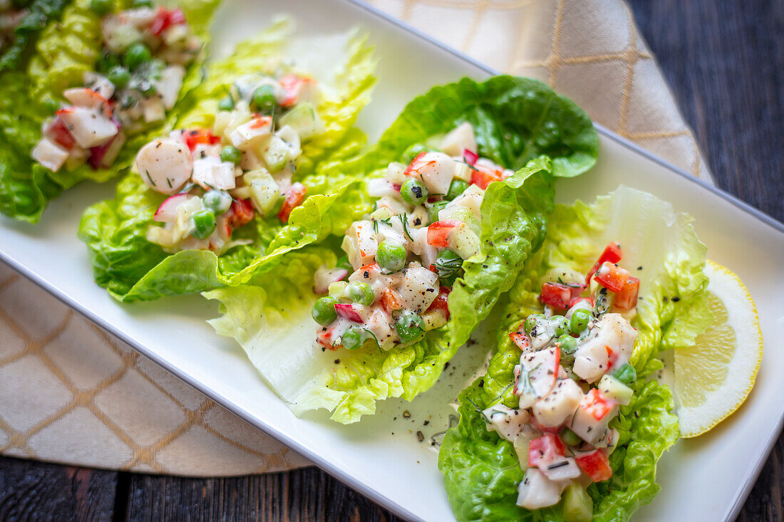 Surimi, cucumber, red radishes and green peas salad