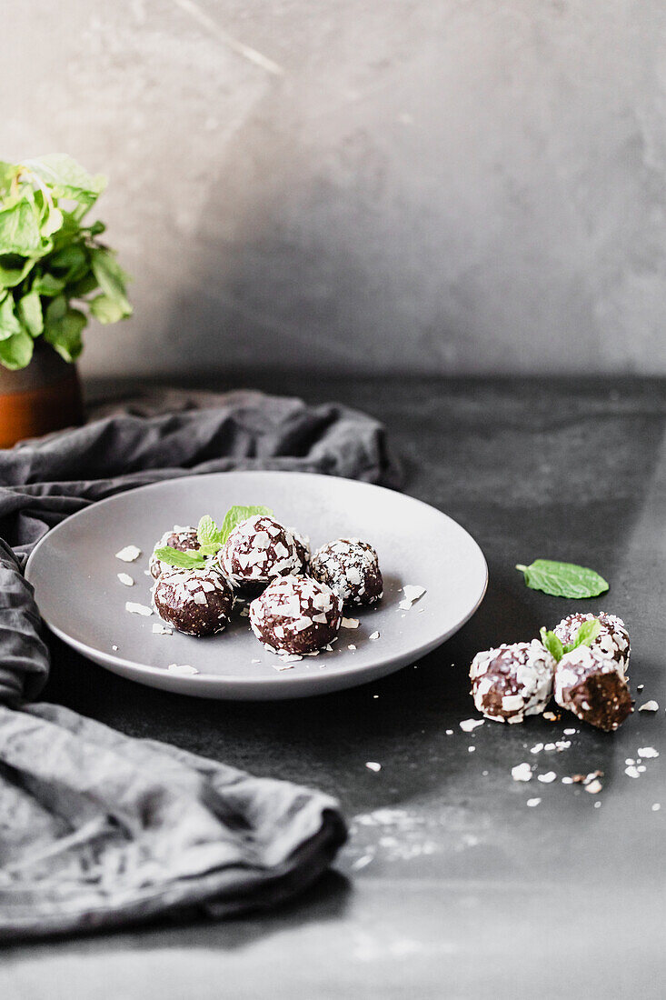 Chocolate, mint and coconut bliss balls with fresh mint
