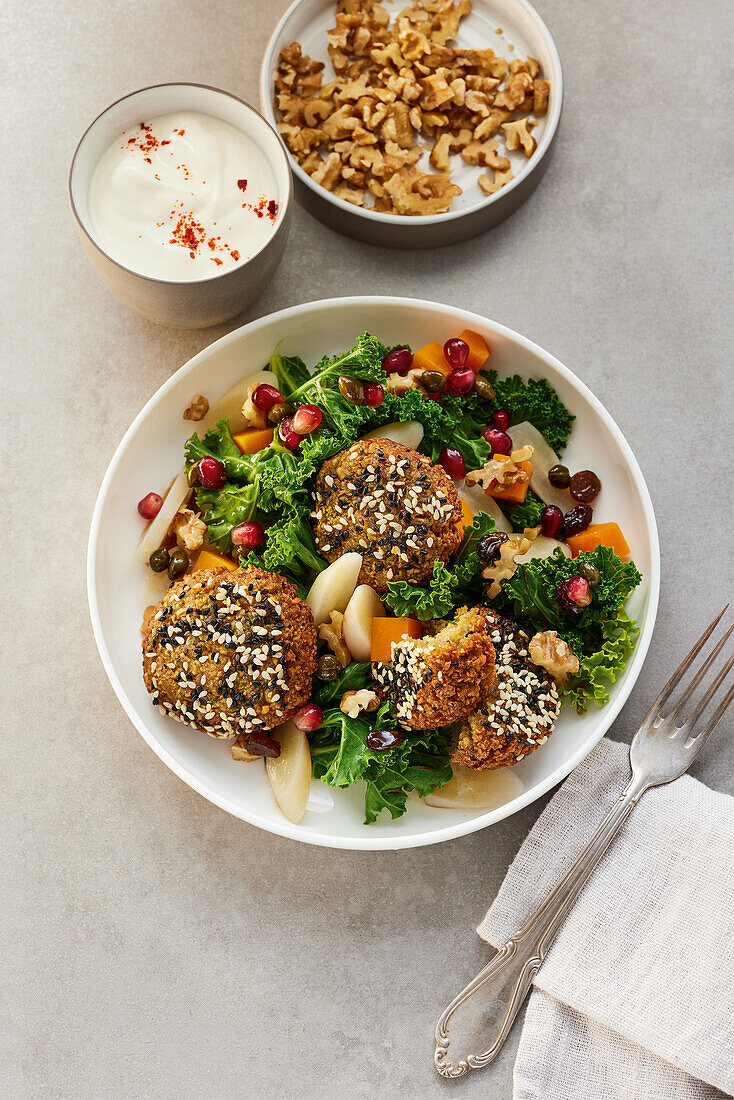 Vegan chickpea balls on a winter salad