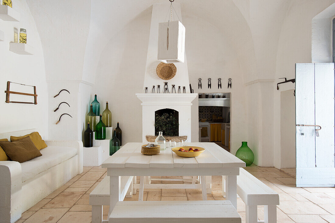 Mediterranean kitchen with dining area and brick fireplace