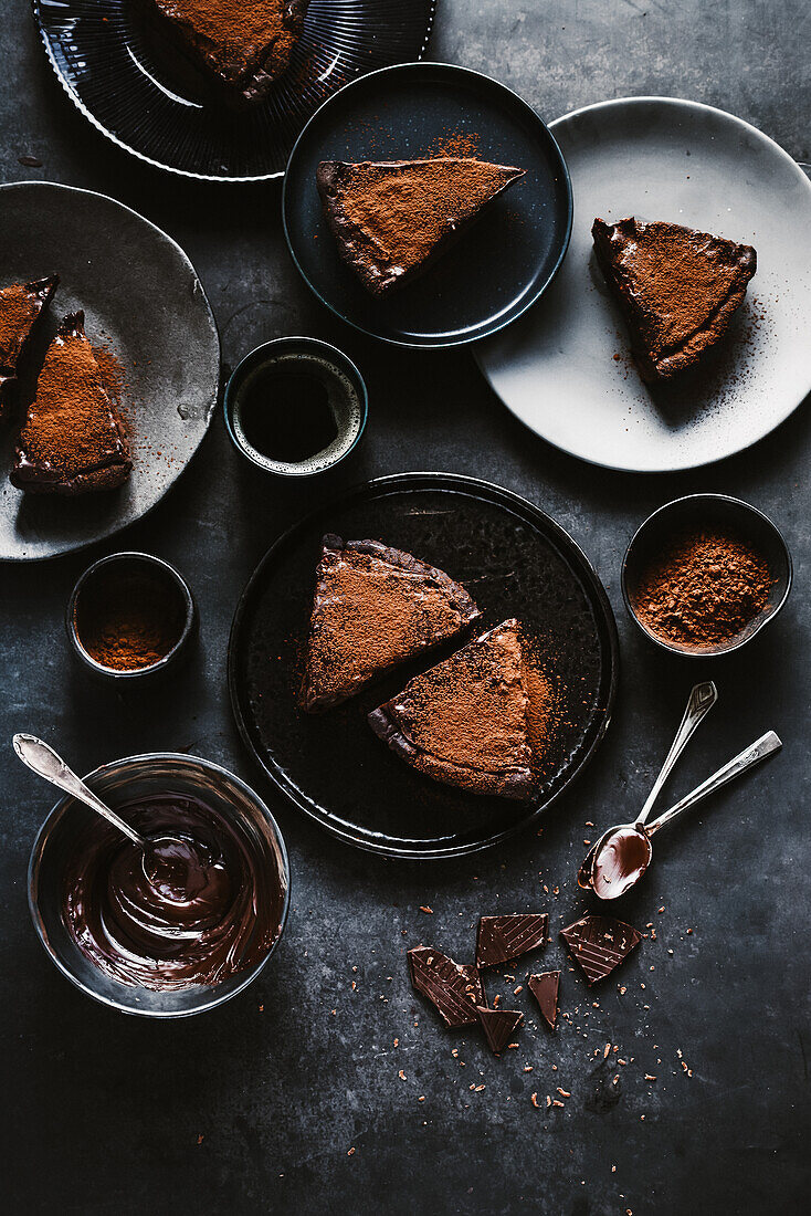 Double chocolate tart sprinkled with cocoa