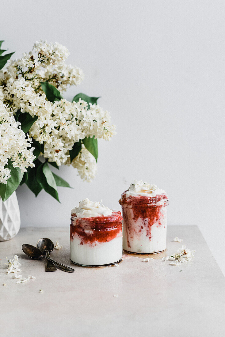 Yoghurt dessert with strawberry mousse and whipped cream