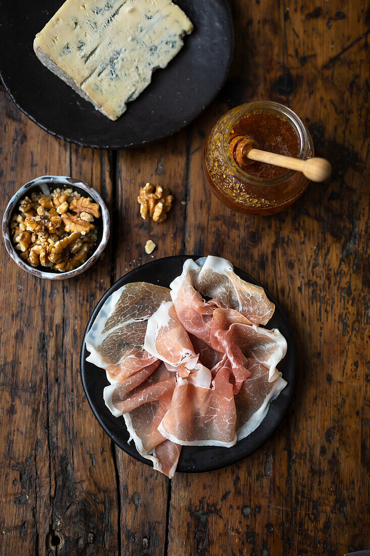 Prosciutto, cheese, honey and nuts