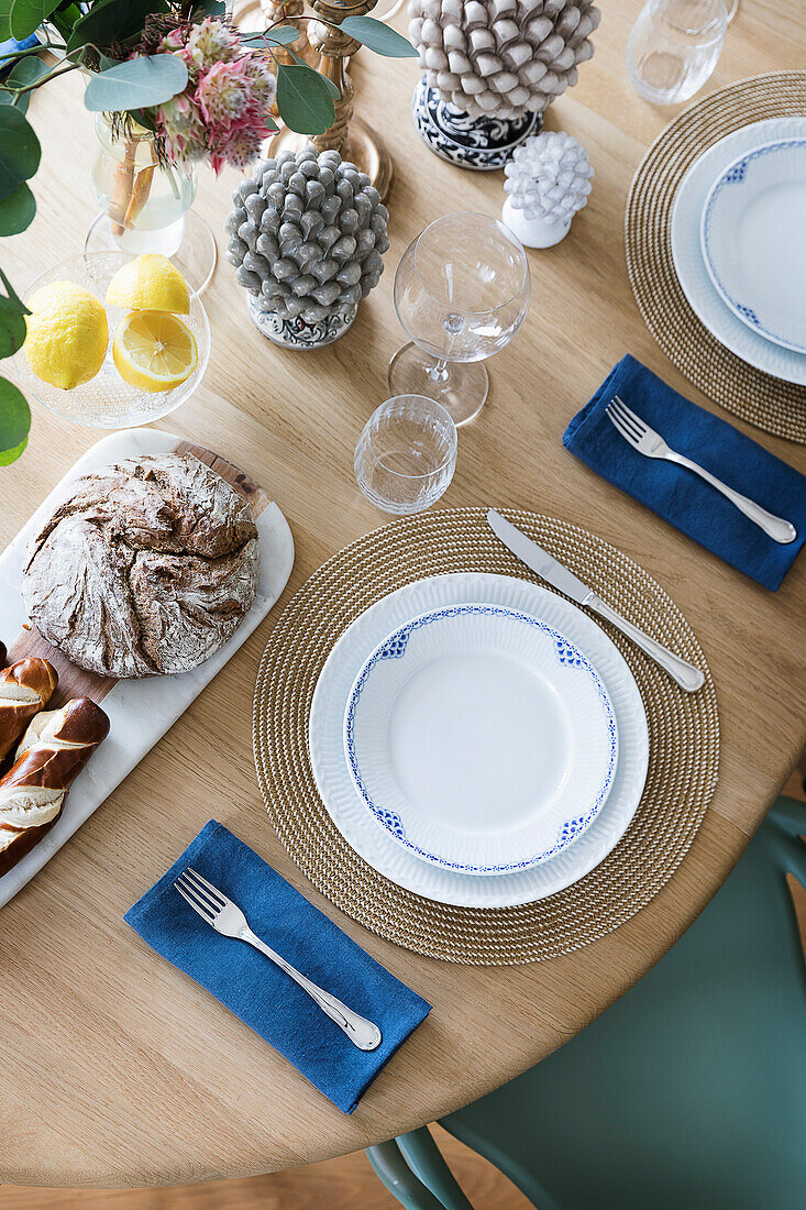 Set table with autumnal decoration and bread