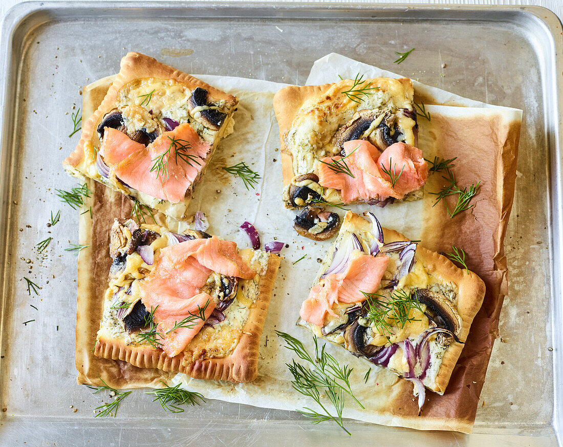 Pizza doppio with salmon, red onions, and mushrooms