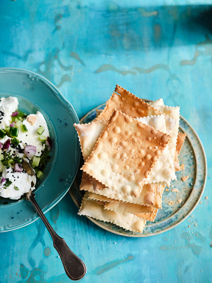 Matzo bread with creamy goat’s cheese and cucumber