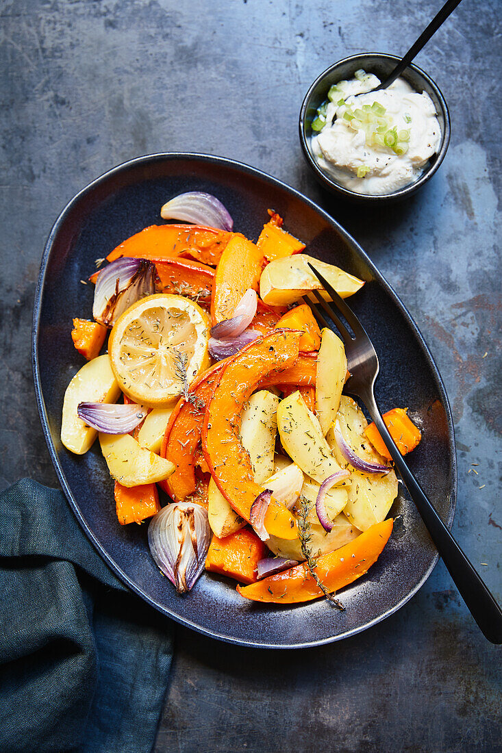 Oven-roasted vegetables with pumpkin, potatoes and lemon