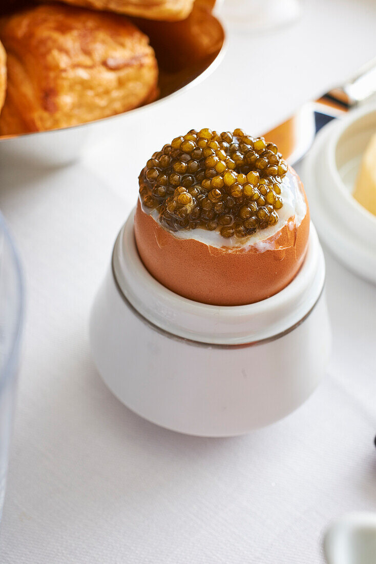 A soft-boiled egg with caviar