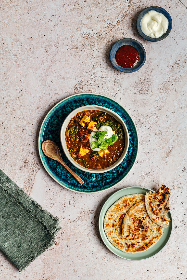 Lentil dahl with paneer, spinach and paratha