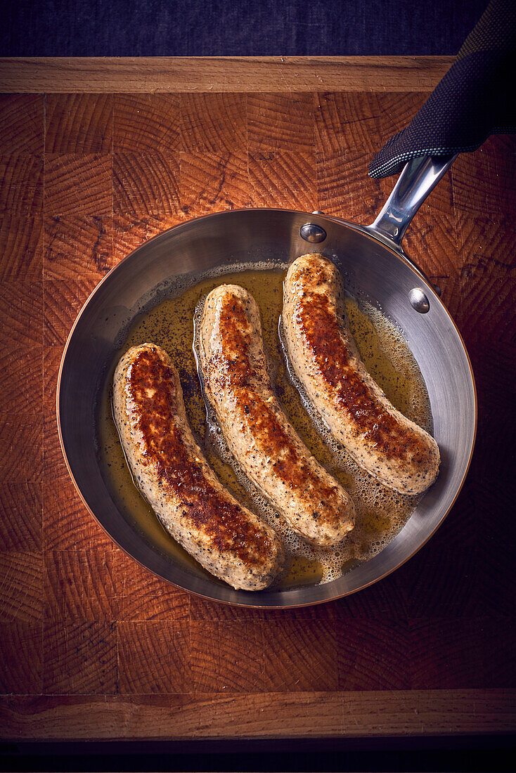 Boudin Blanc (French white sausage) in a pan