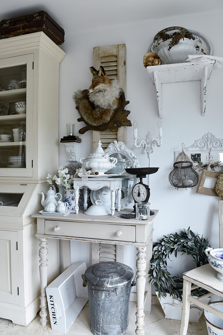 Lavishly decorated console table with vintage-style, shabby-chic decorations