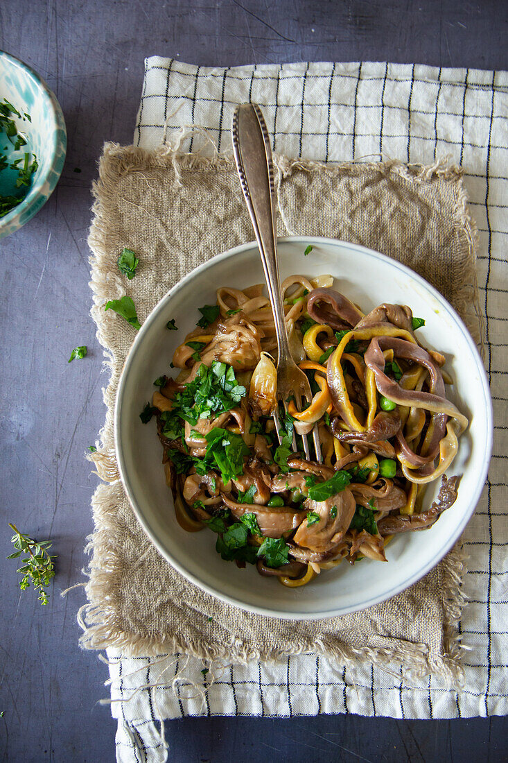 Homemade tagliatelle with mushrooms and parsley