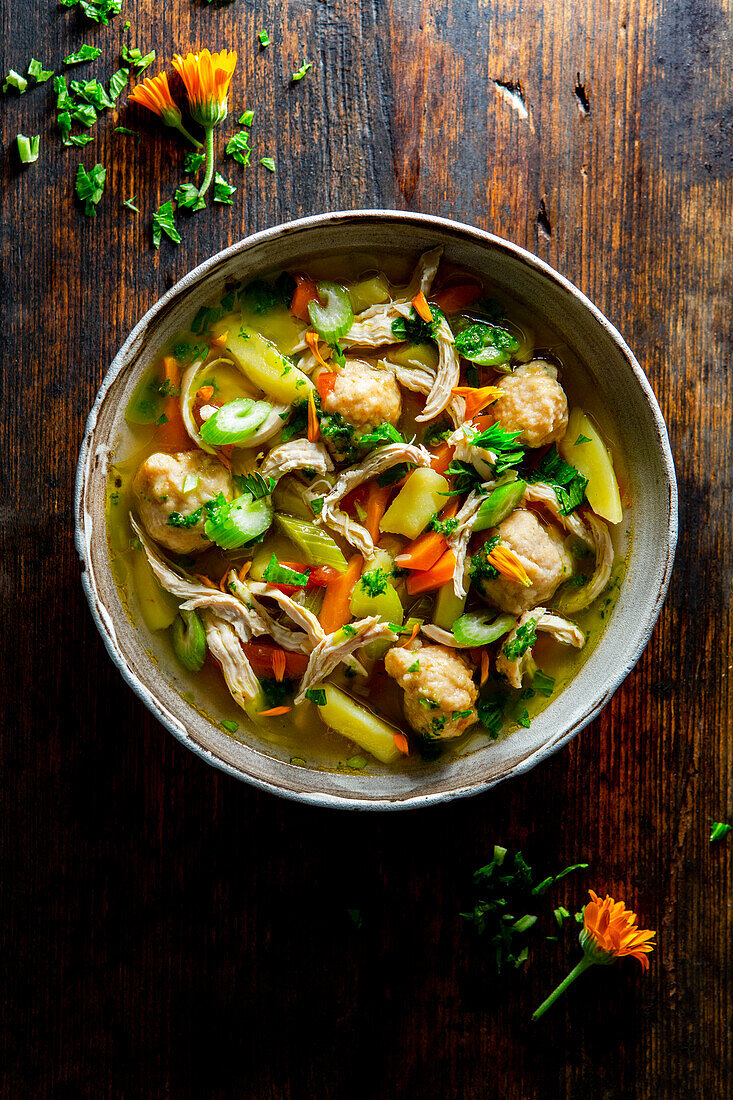 Vegetable soup with chicken and semolina dumplings