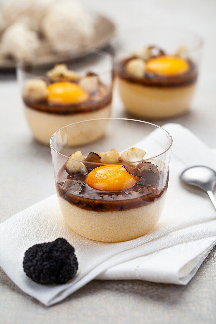 Egg dish in a glass with black truffle