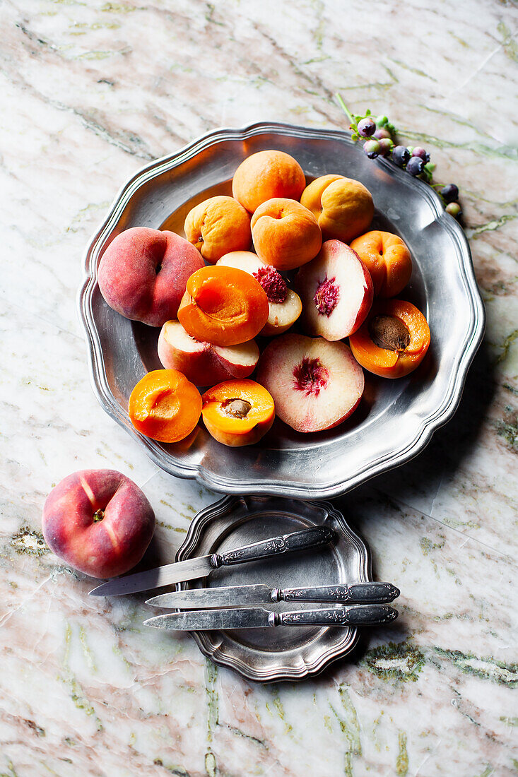 Bowl of Peaches; Whole and Half a Peach