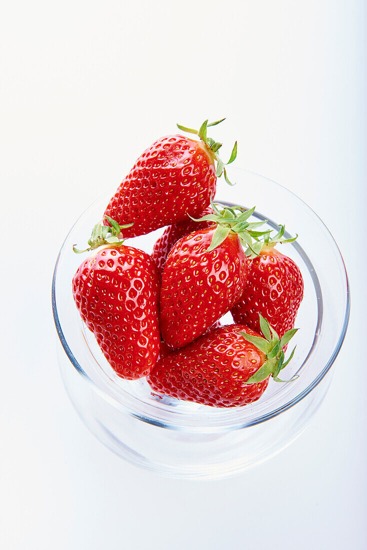 Fresh strawberries in a glass bowl