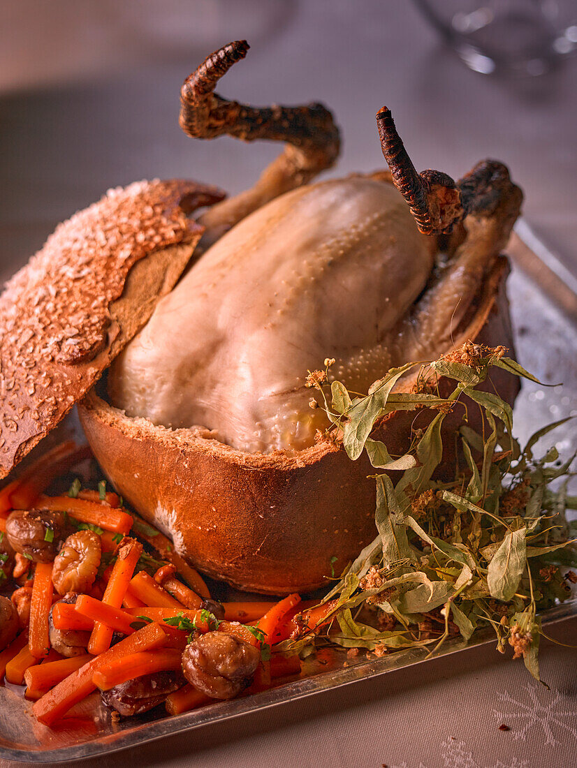 Whole chicken baked in bread dough