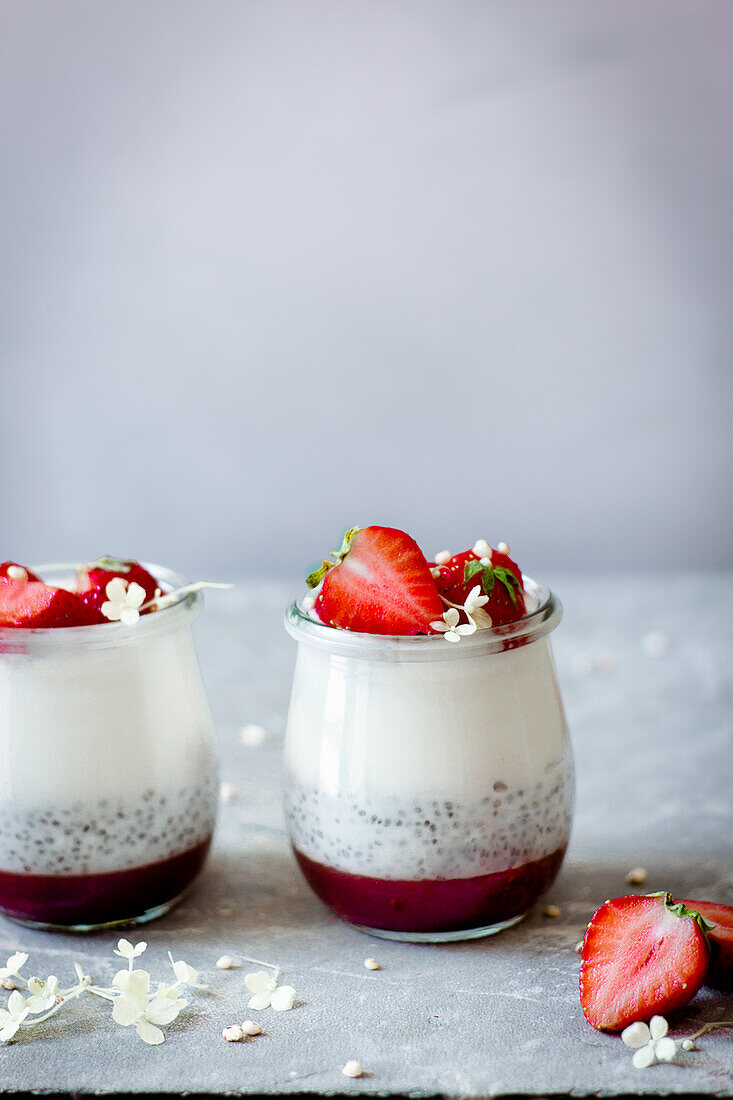 Layered dessert with yoghurt, chia seeds and strawberries
