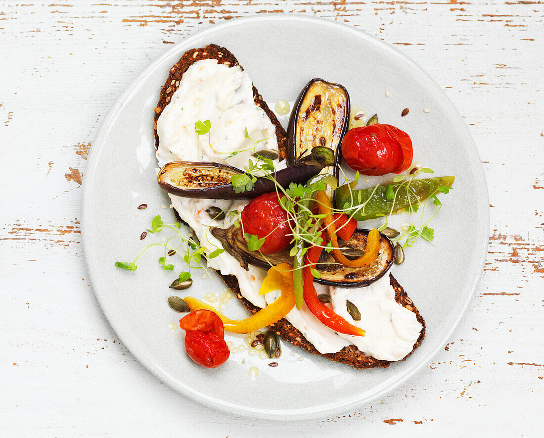 Open faced sandwiches with cream cheese and grilled vegetables