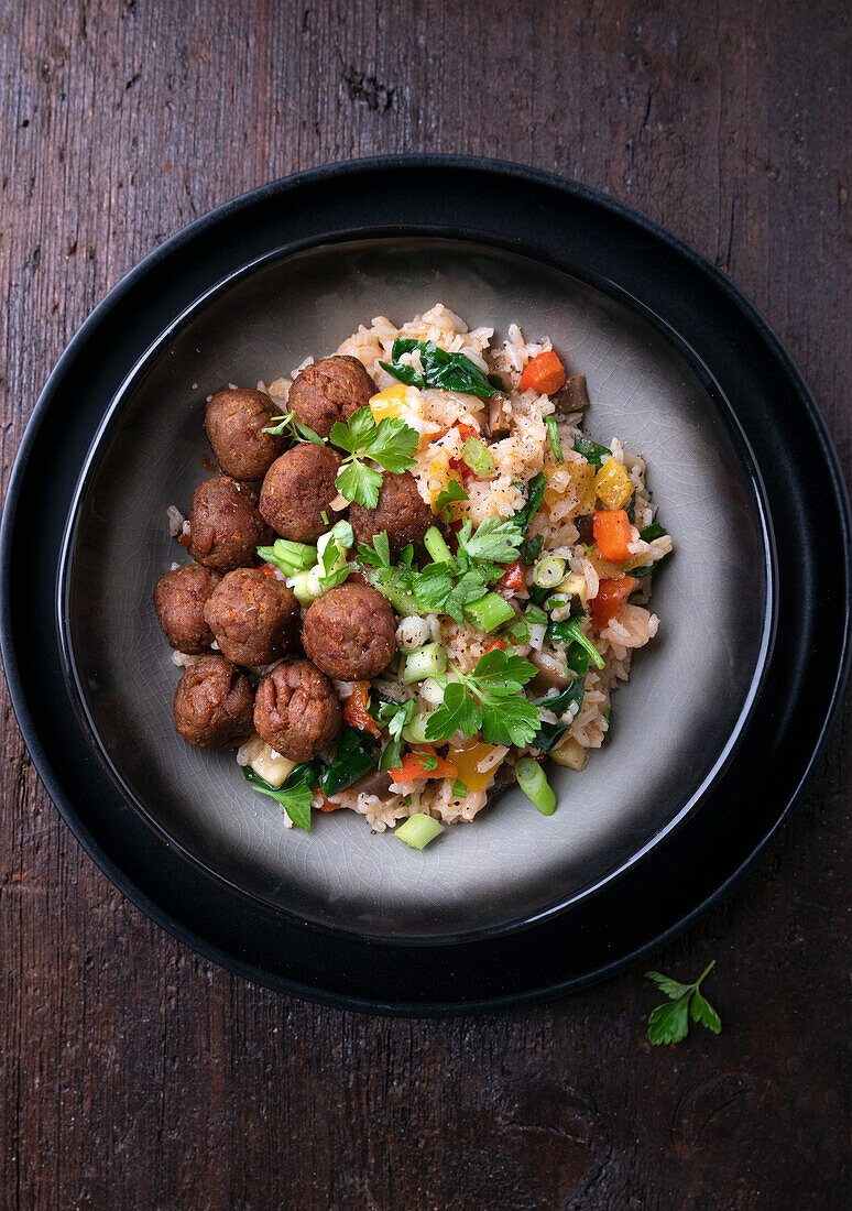 Vegan mini meatballs made from pea protein with vegetable fried rice