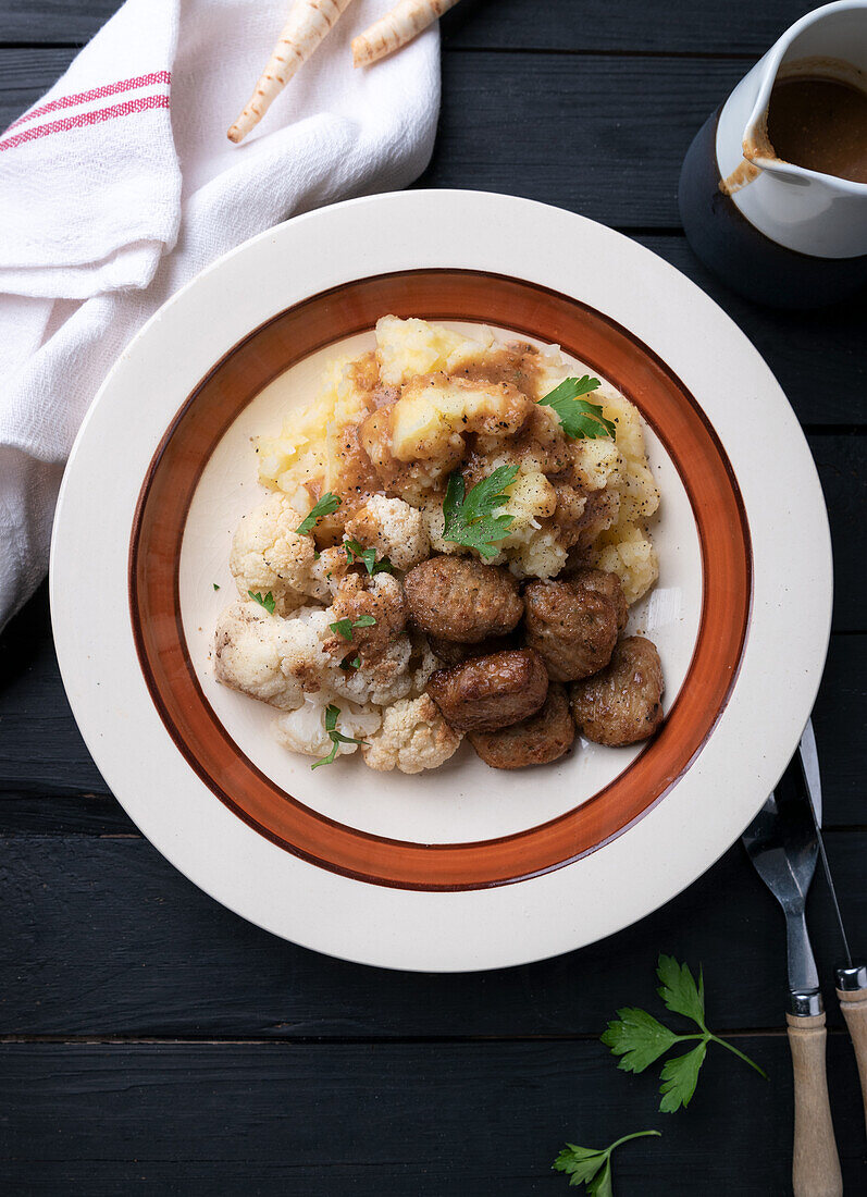 Mashed potatoes and parsnips with cauliflower and vegan meatballs