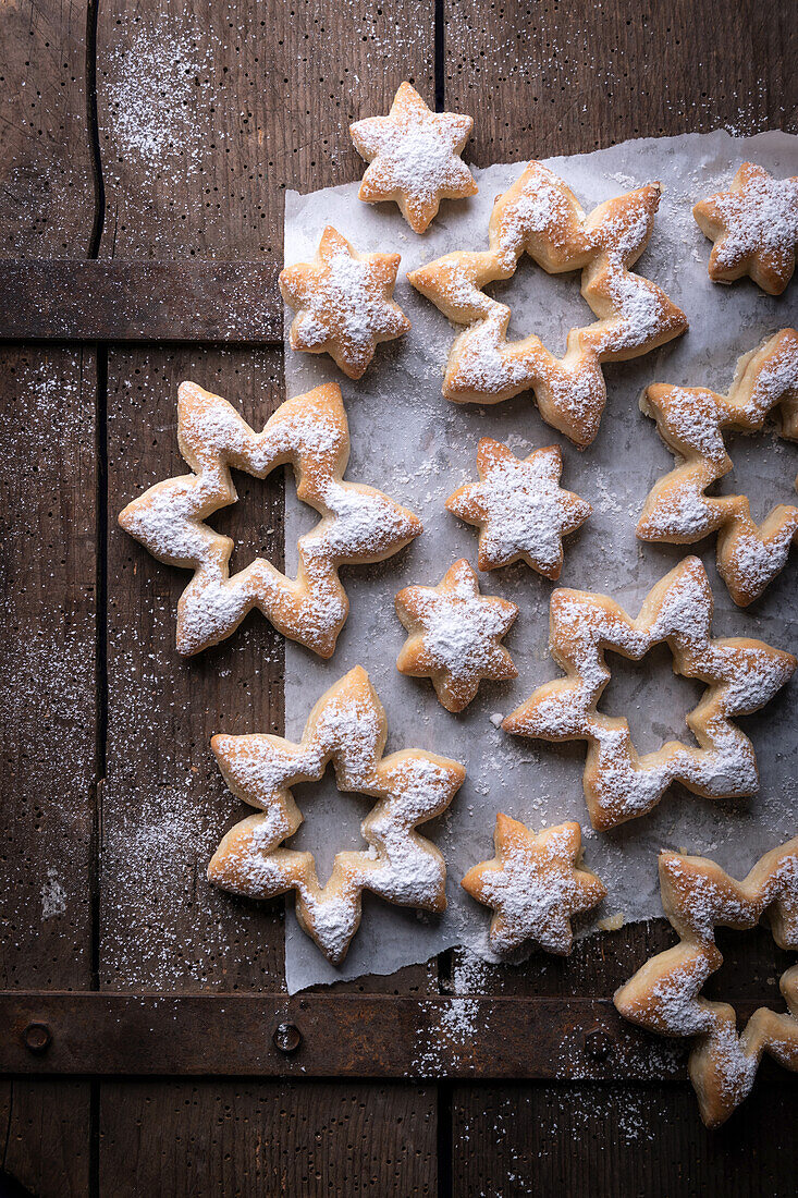 Sweet yeast pastry in star shape with icing sugar