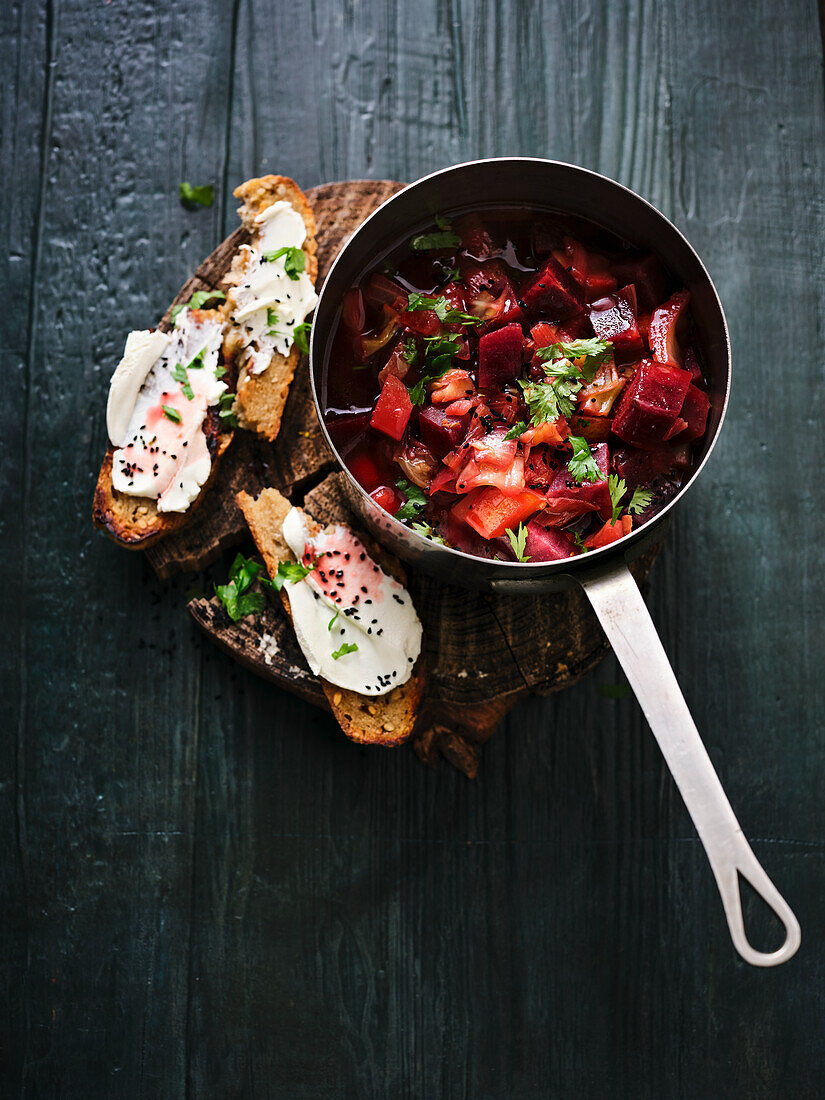 Beetroot and beer stew with rye bread and cream cheese crostini