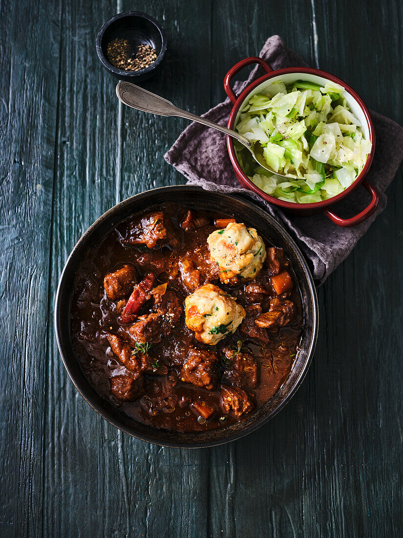 Stout beef goulash with pretzel dumplings and steamed white cabbage