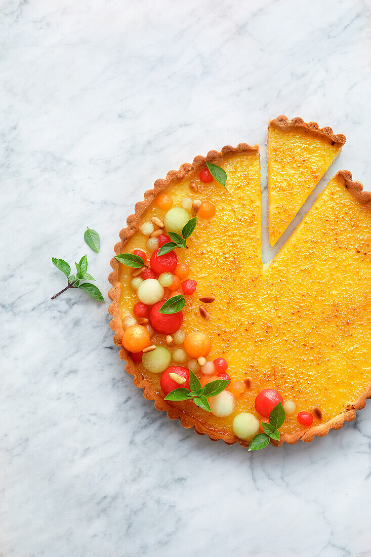 Caramelised limoncello tart with colourful melon salad