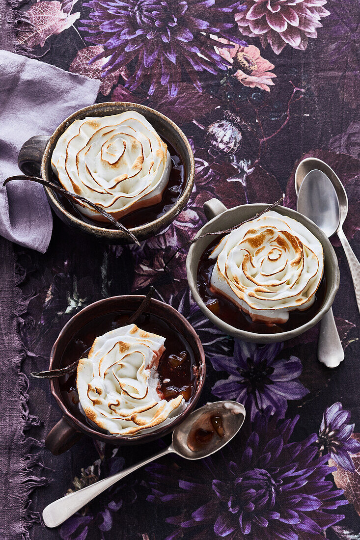 Plum soup with meringue topping