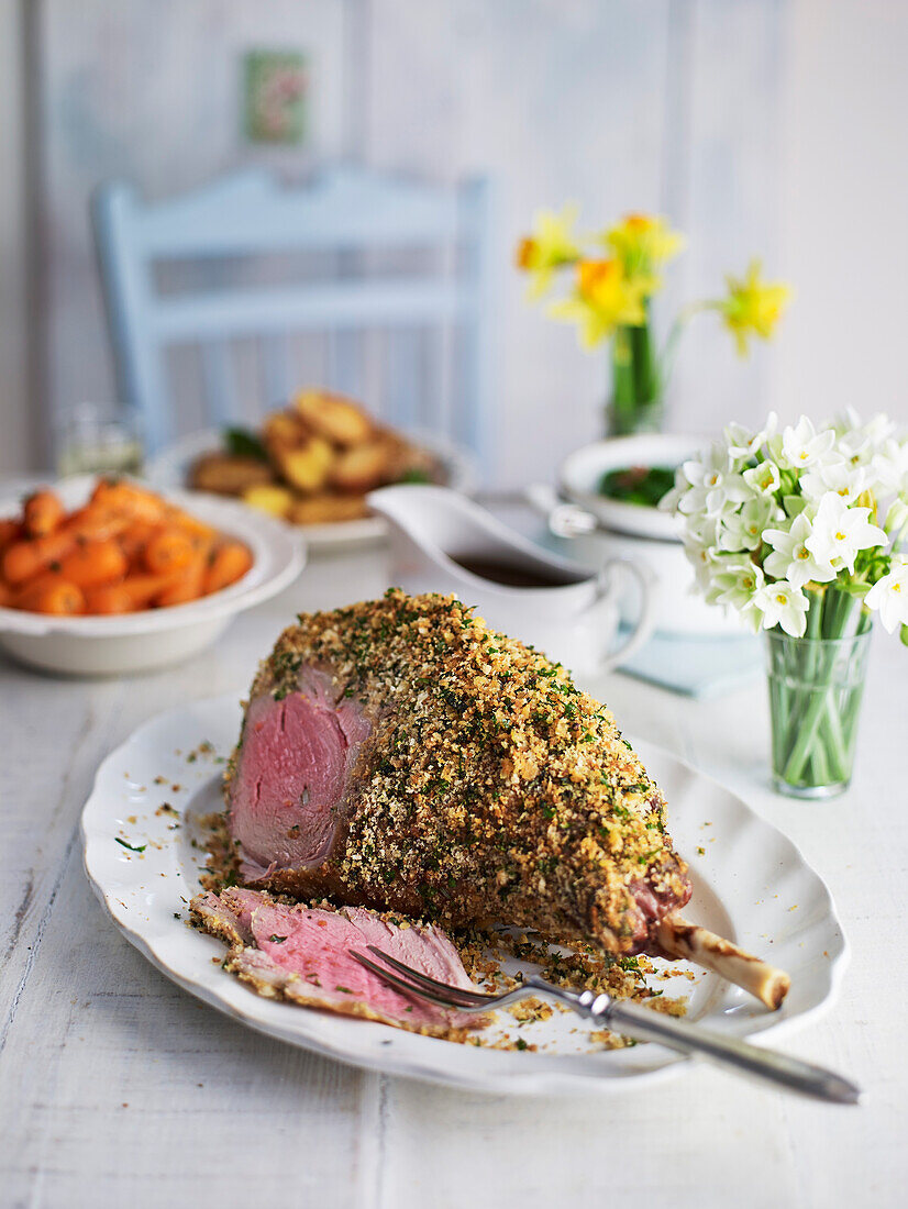 Herb-crusted leg of lamb with red wine gravy