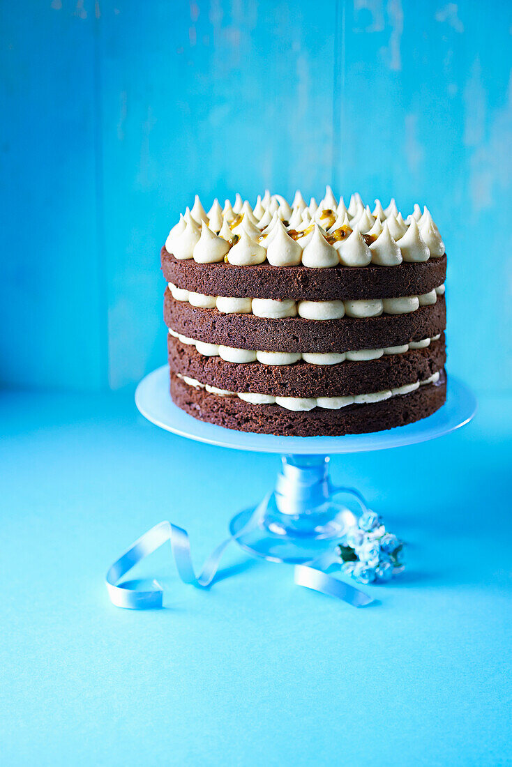 Chocolate layer cake with passion fruit icing