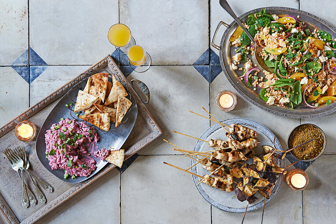 Moroccan meze - couscous salad, beetroot dip, chicken skewers