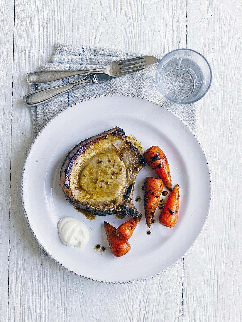 Cumin pork chops with honey carrots