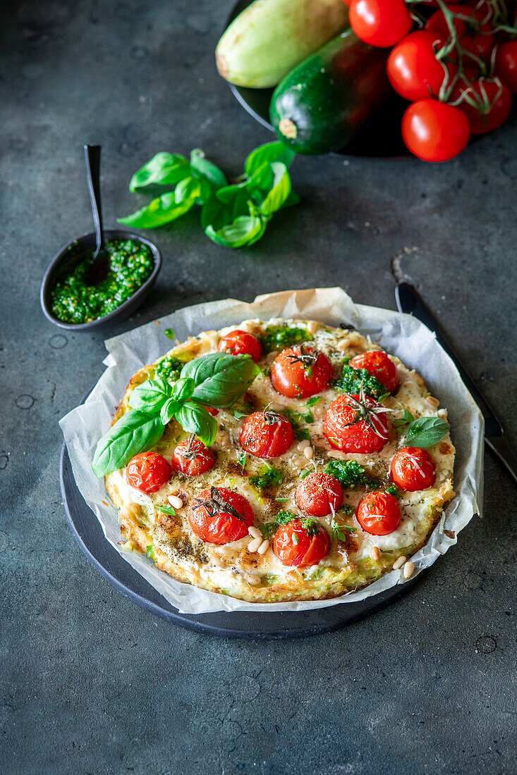 Pizza with zucchini crust and cherry tomatoes