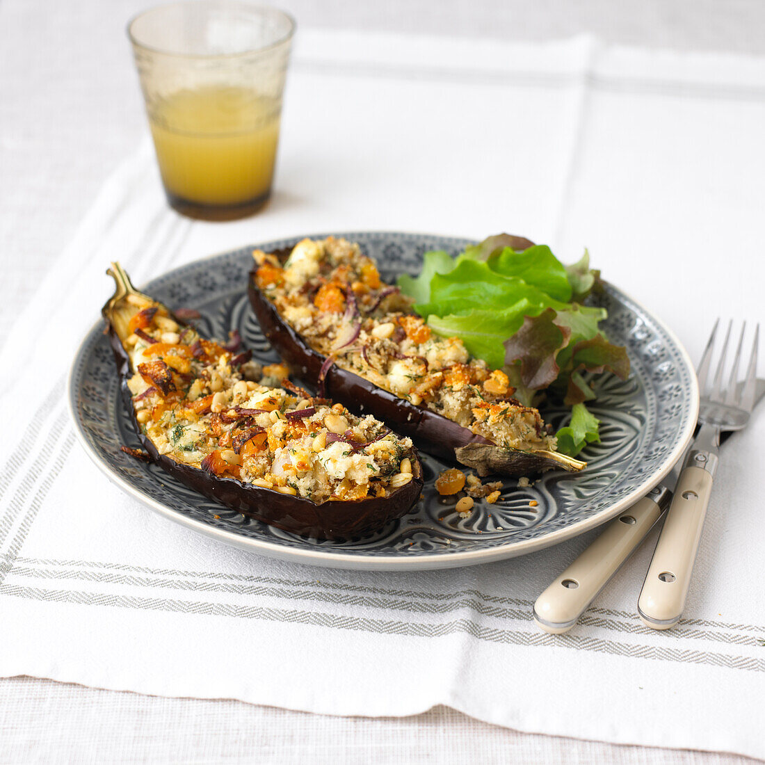 Aubergine topped with goat's cheese and apricot crust