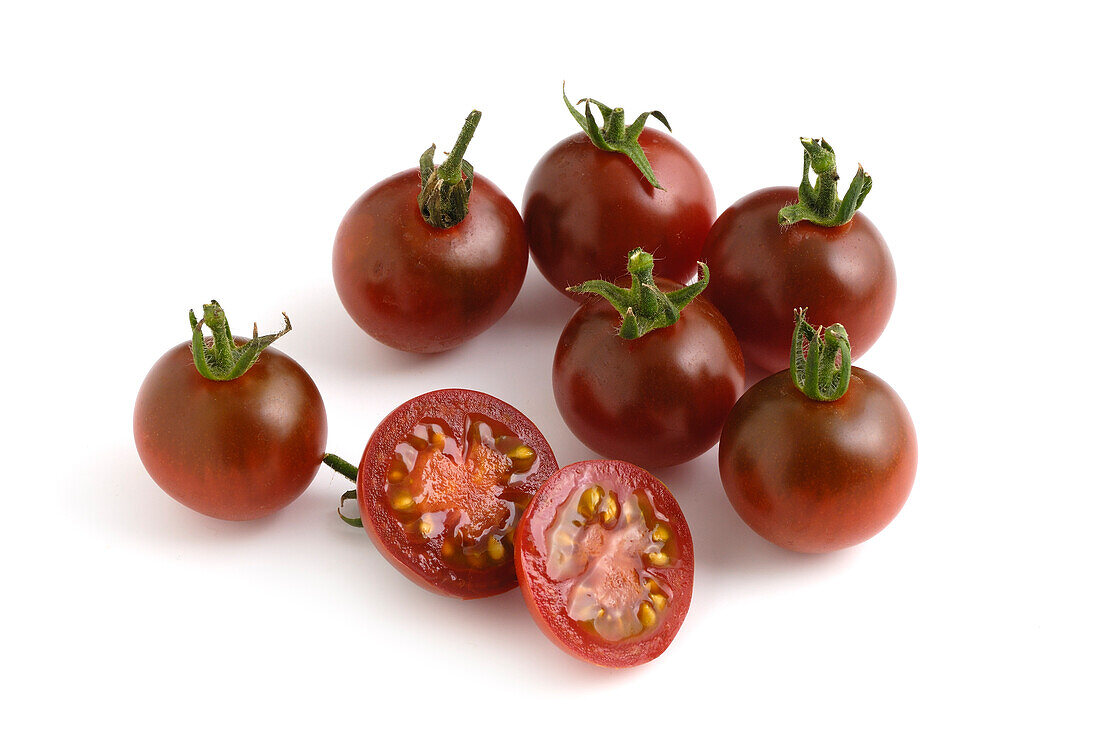 Whole and sliced Dutch brown berry tomatoes