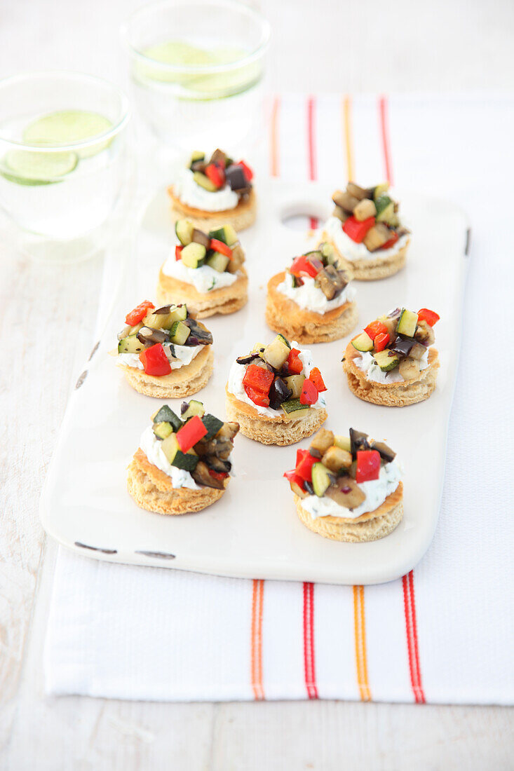 Mini naan toasts topped with vegetables