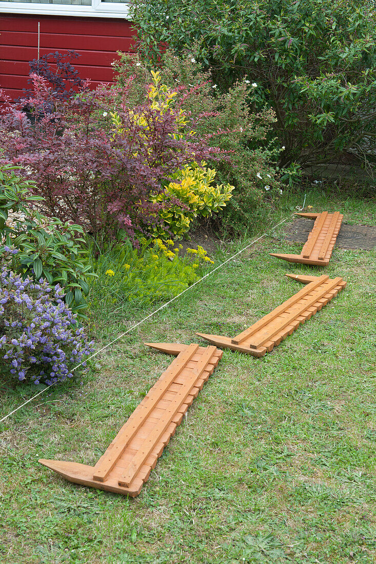 Line marking space for wooden border in garden