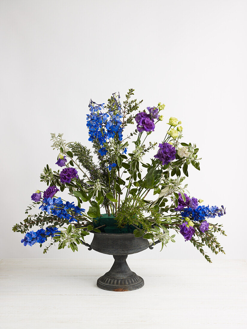 Summer flowers arrangement in urn