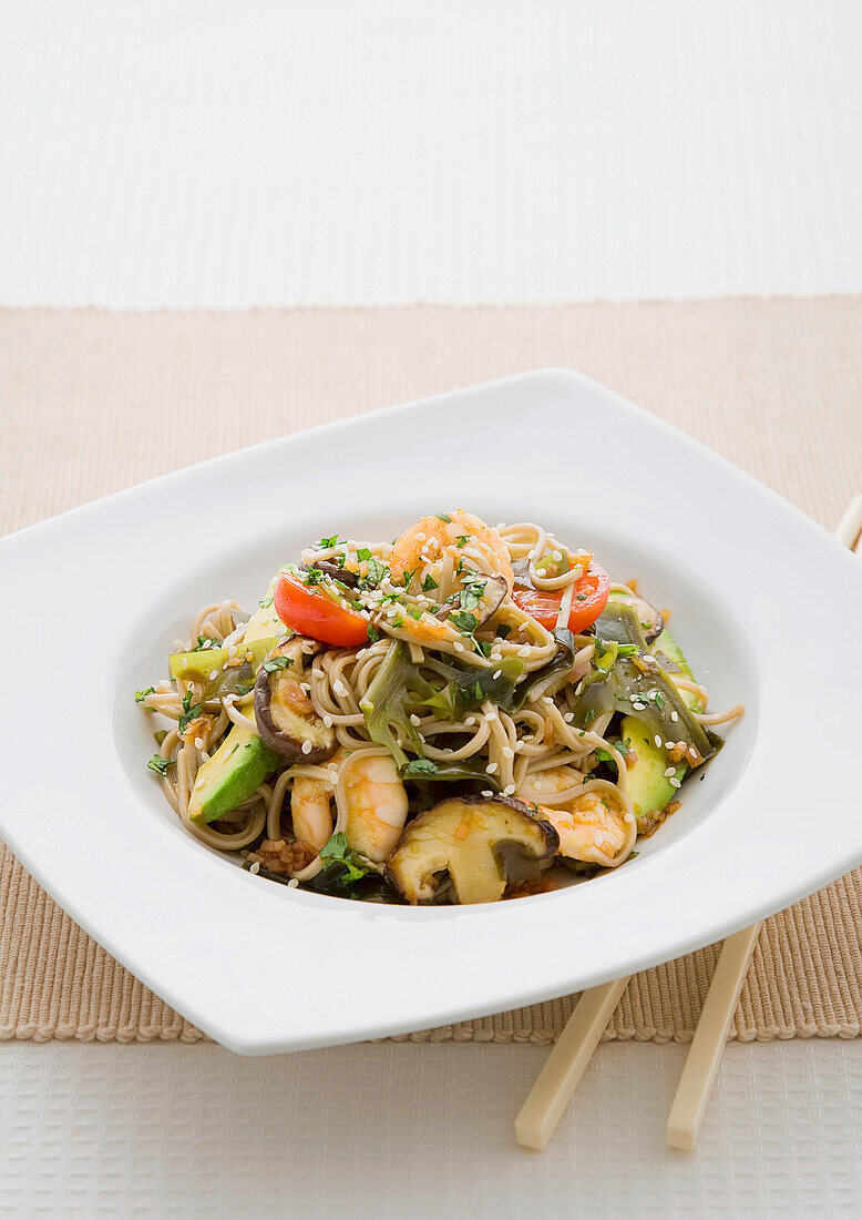 Plate of soba noodles with prawns and vegetables