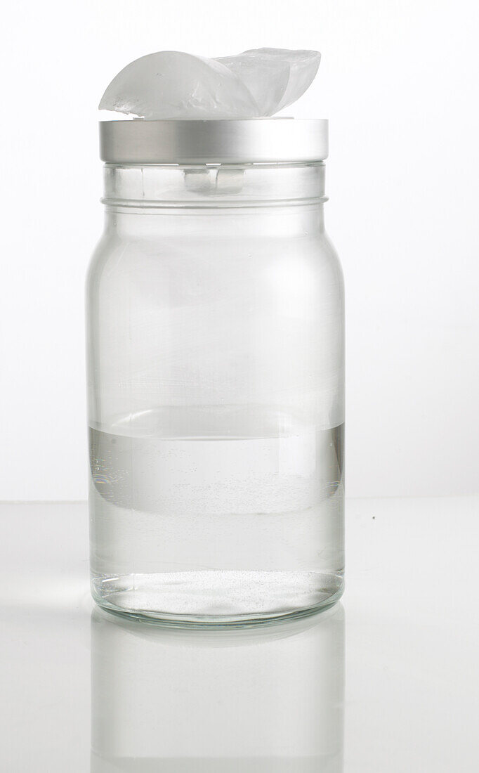 Close-up of glass jar with ice