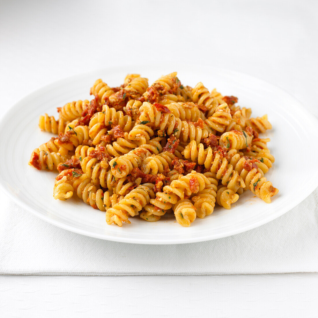 Fusilli pasta with sun-dried tomato pesto