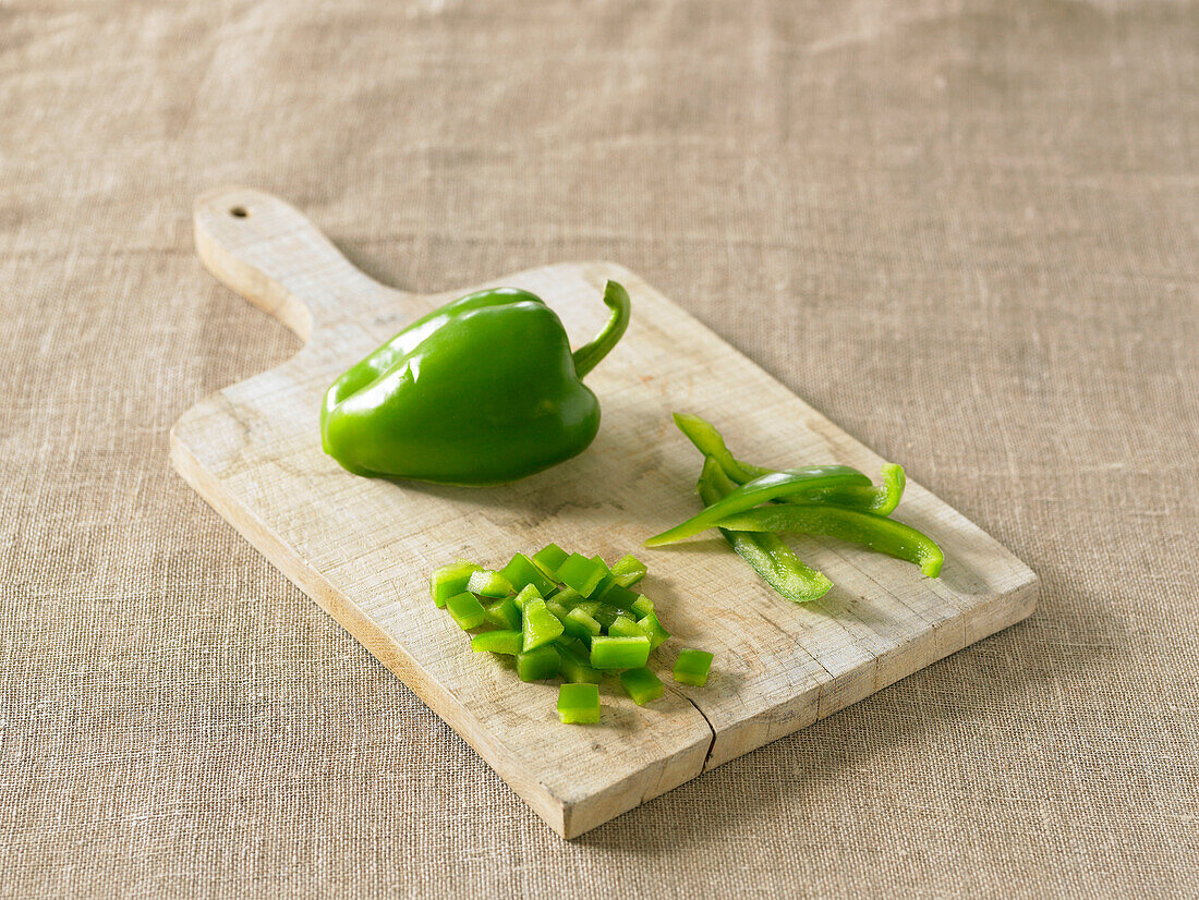 Green pepper on chopping board