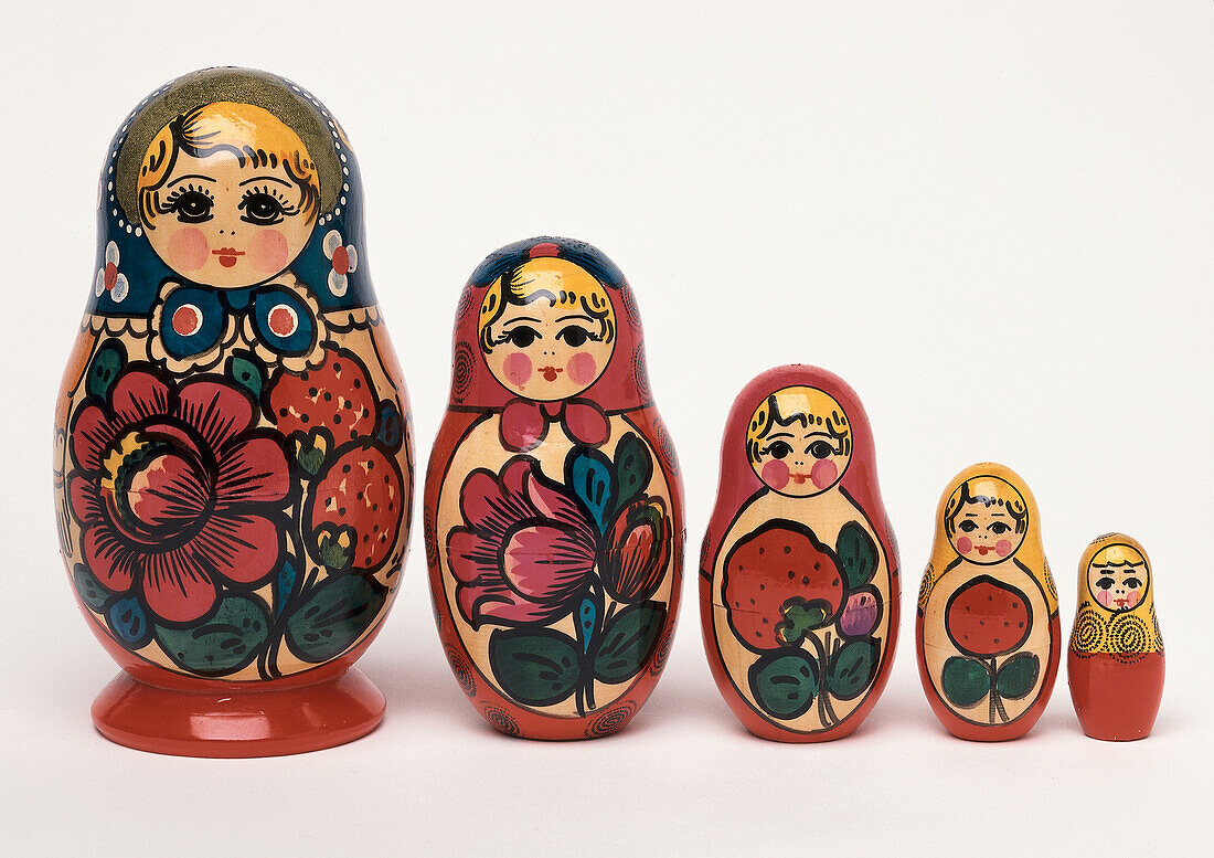 Set of nested five painted wooden Russian peasant dolls