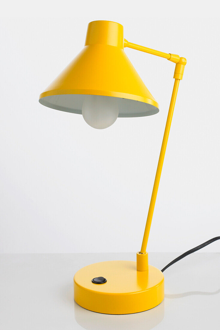 Yellow angle-poise lamp
