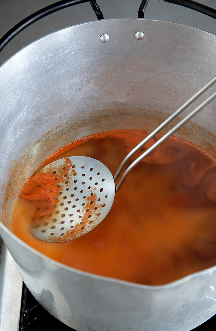 Boiling and skimming jam